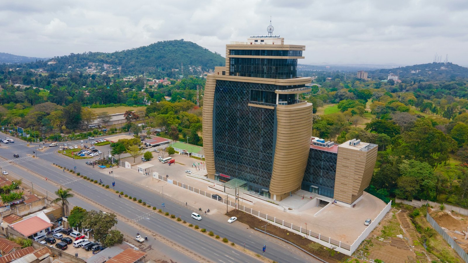 Modern commercial tower beside a highway in Arusha, Tanzania