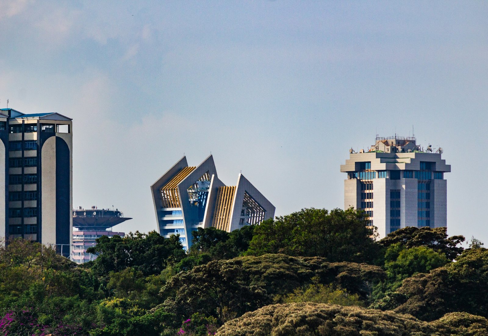 Modern office towers rising above trees in Nairobi